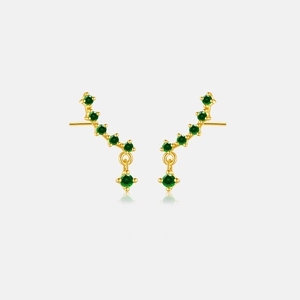 Close-up of golden S925 sterling silver earrings with sparkling green gemstones and drop design