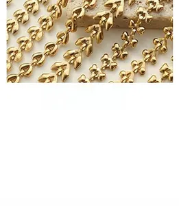Macro shot of 18K gold plated geometric heart chain links with a matte brushed finish