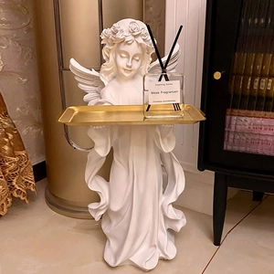European vintage angel statue floor decoration with a gold tray for home storage