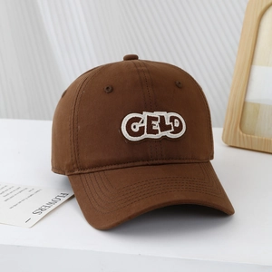 Detailed embroidery of CELD letters on dark brown cotton canvas baseball cap for kids
