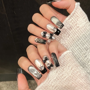 Handmade black and silver glitter coffin press-on nails with 3D bows and rhinestones