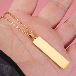Minimalist gold stainless steel rectangle bar pendant necklace for women on pink background