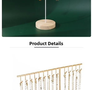 Detail view of golden jewelry organizer with multi-hook stand and wooden base
