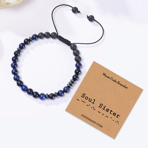 Detail of Morse code bracelet with blue tiger eye, volcanic stone and Soul Sister card