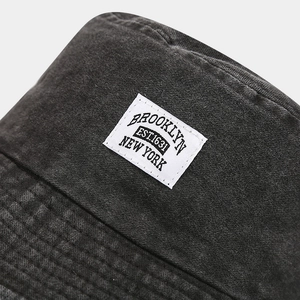 Vintage dark grey washed canvas bucket hat featuring Brooklyn embroidery for sun protection