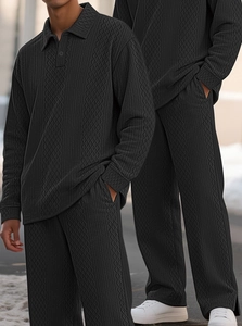 Detailed macro view of Men's dark grey knit polo set featuring textured diamond pattern