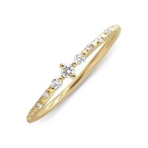 Close-up of a slender gold S925 silver ring featuring a central white zircon and side stones