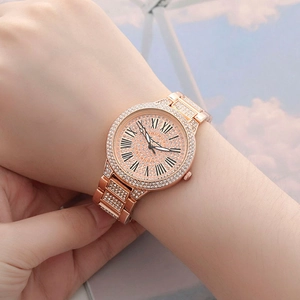 Elegant rose gold women's watch with Roman numerals and shimmering crystal pavé bezel
