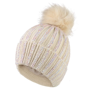 Beige knitted pom-pom beanie for women featuring iridescent rhinestones and plush lining