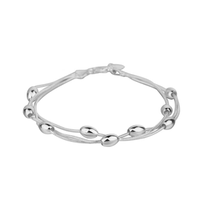 Detail shot of silver double-layered snake chain bracelet with polished oval beads