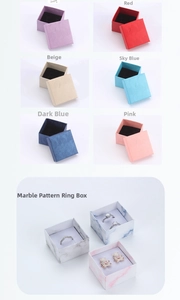 Multiple colorful jewelry gift boxes and marble pattern ring cases with foam inserts