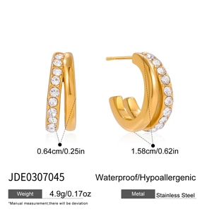 Detail view of 18K gold plated stainless steel C-shaped earrings with clear zircon stones