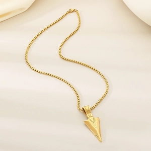 Hip hop gold arrow pendant necklace with box chain on light satin background