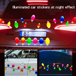 Multi-colored reflective Christmas bulb magnets shown on car tail and doors at night