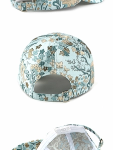Detail view of ethnic jacquard baseball cap with adjustable metal buckle and 100% polyester label
