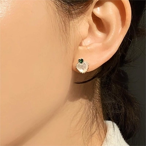 925 Sterling silver heart stud earrings with green zircon and mother of pearl on model