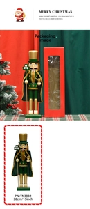 Detail of 38cm wooden nutcracker soldier in green velvet cloak with gold trim and staff