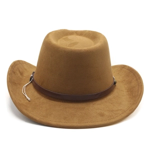 Detail of brown faux suede cowboy hat with studded leather band and wide brim