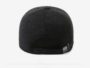 Detail of grey wool baseball cap showing adjustable strap and silver metal buckle closure