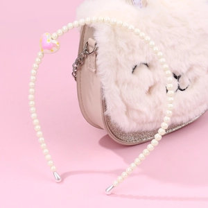 Elegant white pearl headband for girls featuring a pink heart pendant on a soft pink background