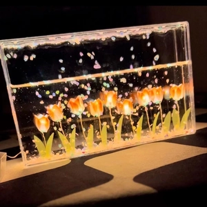 Handmade DIY orange tulip night light with flowing petals and warm ambient lighting