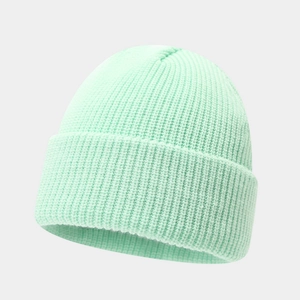 Close-up of mint green knit beanie featuring premium ribbed texture and folded cuff detail