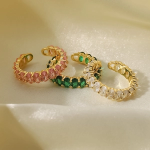 Detailed view of 18k gold plated adjustable rings with pink green and white zircon
