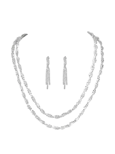 Close-up of luxury silver double-layer crystal necklace and matching tassel earrings