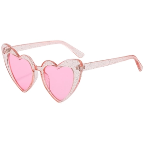 Close-up of pink translucent heart-shaped sunglasses with glitter and UV400 lenses