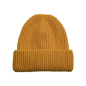Close-up of ginger yellow ribbed knit beanie showing thick texture and folded brim
