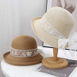 French straw sun hat with floral lace ribbon and rolled brim in beige and brown colors