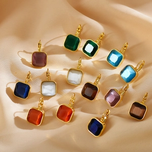 Detail of colorful square gemstone leverback earrings in gold plating on silk