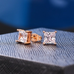 Macro shot of princess cut square zircon earrings with 18k gold plated four-prong setting