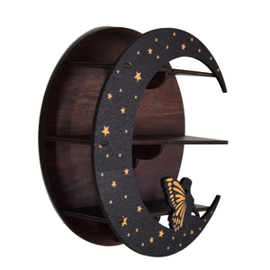 Detail of wooden crescent moon shelf with gold star patterns and butterfly cutout