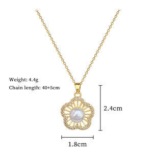 Detailed view of gold pearl flower pendant with measurements and sparkling diamond accents