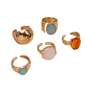 Five-piece set of gold geometric open rings with oval resin gemstones and hammered texture