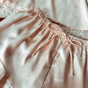 Champagne silk satin pajama set with camisole and bow shorts on soft white fleece