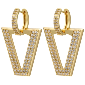 Macro detail of V-shaped gold earrings with micro-pave cubic zirconia crystals