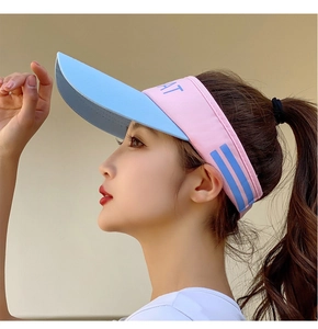 Detail of pink and blue open-top sun visor with AT embroidery for outdoor sports