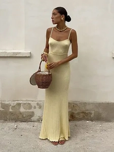 Slim fit yellow knitted maxi dress with ribbed details for a stylish summer vacation look