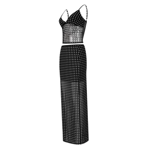 Detail of two-piece mesh polka dot set featuring crop camisole and long skirt on white background