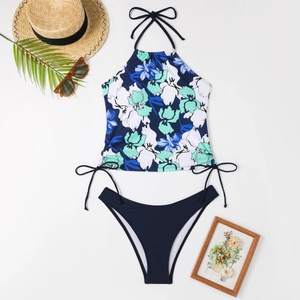 Flat lay view of printed halter bikini with drawstring top and navy blue high-cut bottoms