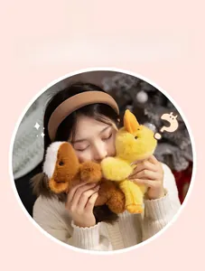 Close-up of a model hugging soft plush brown horse and yellow duck animal toys