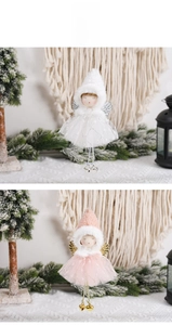 Detailed view of handmade Christmas angel ornaments with tulle skirts and golden bells
