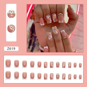 White French glitter press-on nails with butterfly designs and rhinestones