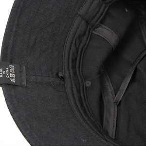Close-up of cotton bucket hat interior showing durable stitching and sweatband detail