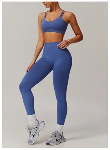 Detail of smog blue yoga set showing the cross back sports bra and high waist leggings