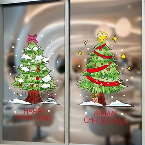 Détail d'autocollants de sapin de Noël avec les textes Merry Christmas et Happy New Year