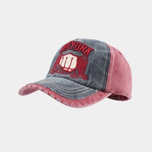 Detail of vintage washed cotton baseball cap with 3D embroidery and contrast stitching