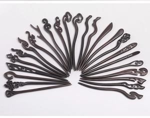 Detailed collection of vintage ebony wood hairpins with intricate Chinese carvings